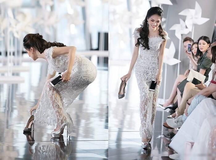 Hương Giang không quản ngại việc đang mặc trên mình chiếc đầm lộng lẫy mà nhanh chóng tiến tới nhặt giày cho Minh Tú.