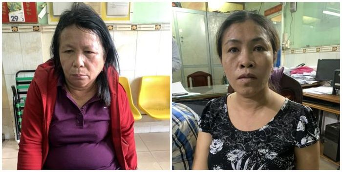 Huỳnh Thị Ngọc Dung và Hồ Tiểu Bình (áo đỏ) tại cơ quan điều tra.