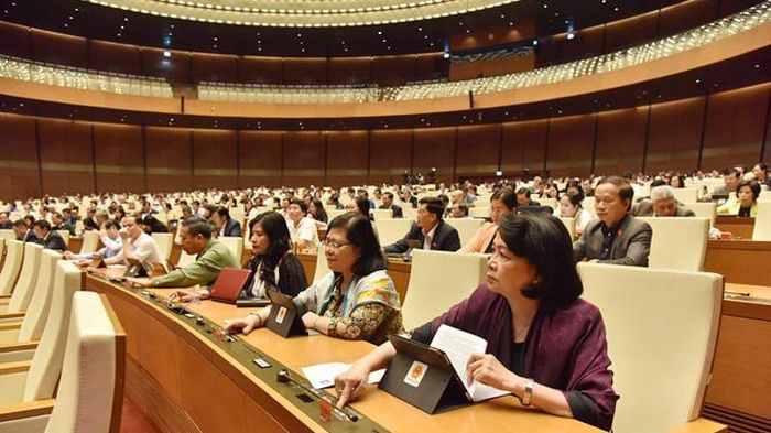 Quốc hội bấm nút thông qua dự thảo luật - Ảnh: Quang Phúc.