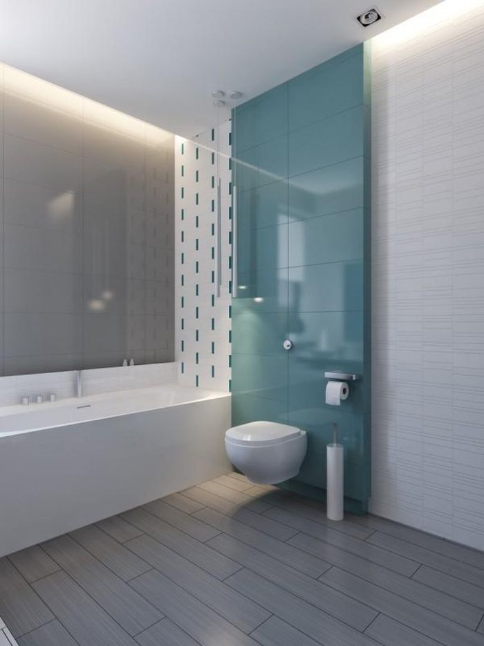 Bức tường màu xanh ngọc khiến phòng tắm trở nên mát mẻ, dễ chịu. 
