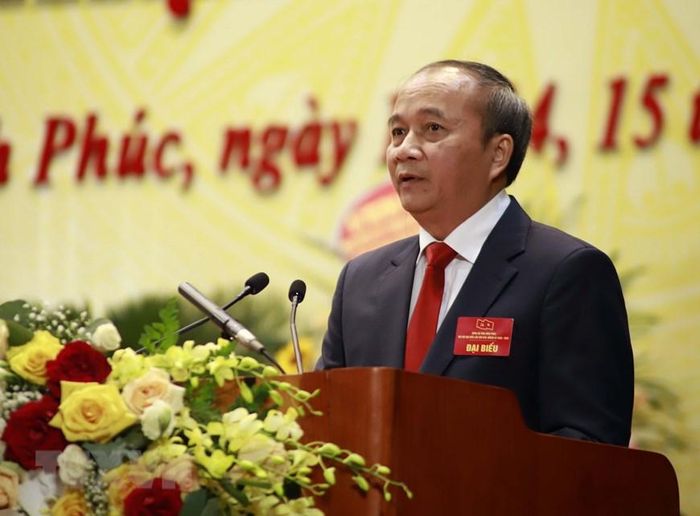  Ông Nguyễn Văn Trì Phó Bí thư Tỉnh ủy, Chủ tịch Ủy ban Nhân dân tỉnh Vĩnh Phúc trình bày Báo cáo chính trị tại Đại hội. (Ảnh: Hoàng Hùng/TTXVN) 