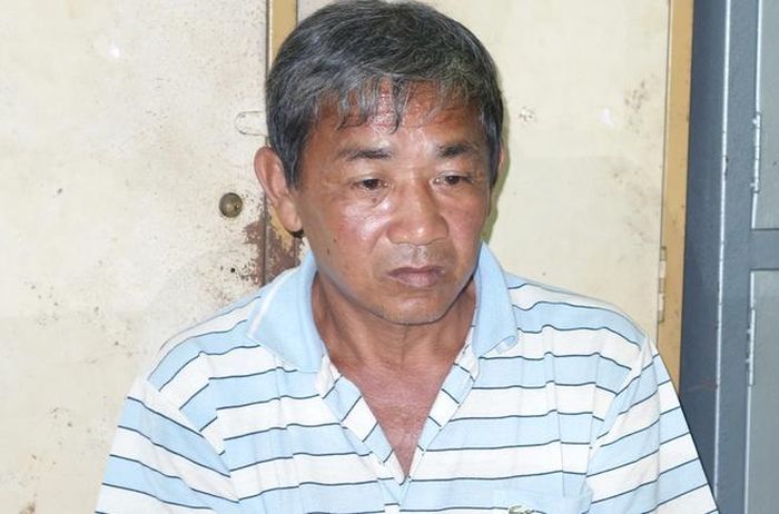  Nghi can Trần Văn Hải bị cảnh sát tạm giữ. Ảnh: Tiến Tầm.