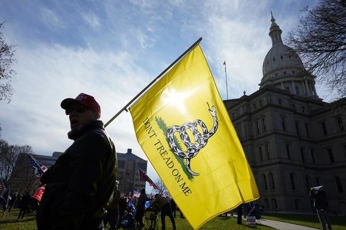 Người ủng hộ ông Trump trong cuộc tập trung lực lượng tại bang Michigan hôm 14/11. Ảnh: AP