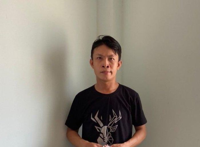 Đối tượng Huỳnh Đình Đạt tại cơ quan điều tra. Ảnh: Công an cung cấp