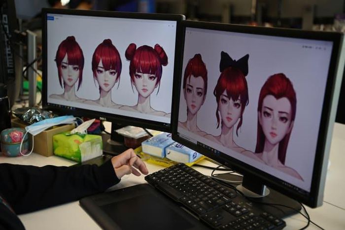  Họa sĩ hoạt hình tại Beijing Mizhi Tech tạo kiểu tóc cho một thần tượng ảo. Ảnh: AFP. 