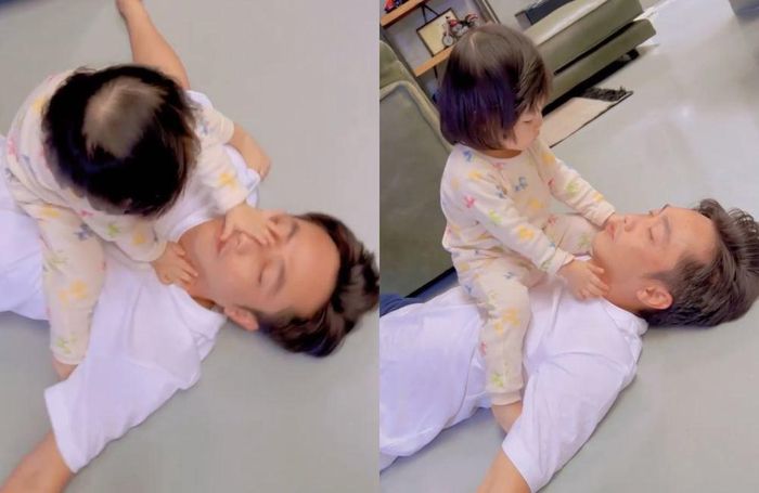 Con gái Cường Đô La rất thích quấn lấy bố.