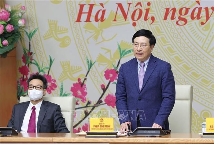 Phó Thủ tướng thường trực Phạm Bình Minh chúc Tết cán bộ, nhân viên Văn phòng Chính phủ. Ảnh: Dương Giang/TTXVN