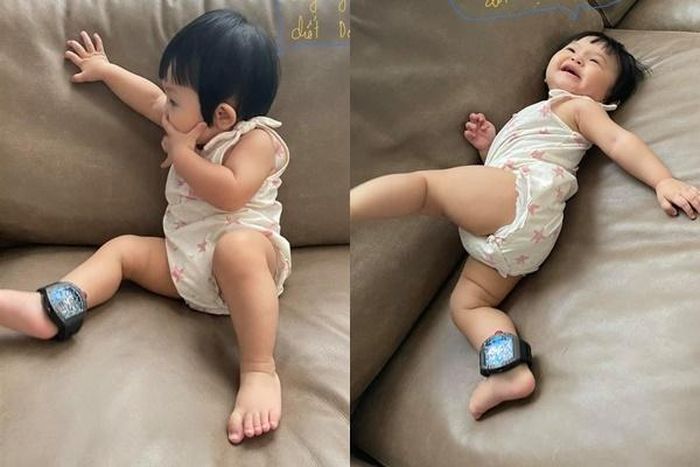 Thậm chí, nhóc tỳ Suchin còn đeo đồng hồ hàng hiệu có giá khoảng 3 tỷ của bố như chiếc vòng chân. Ảnh: FBNV