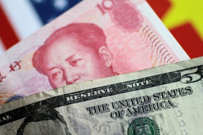Đồng nhân dân tệ giảm mạnh so với đồng USD. Ảnh: Reuters.