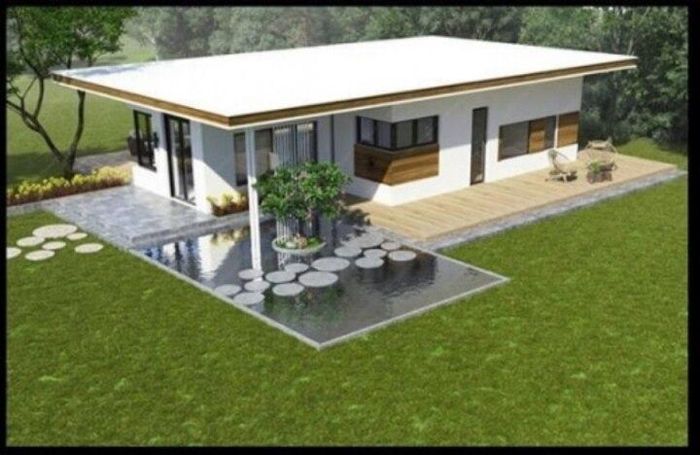 Được xây trong khuôn viên rộng lớn, mẫu nhà mái bằng hiện đại có hòn non bộ và trồng thêm hoa sen, súng...tạo cảnh quan đẹp mắt. (Ảnh: Homemy)