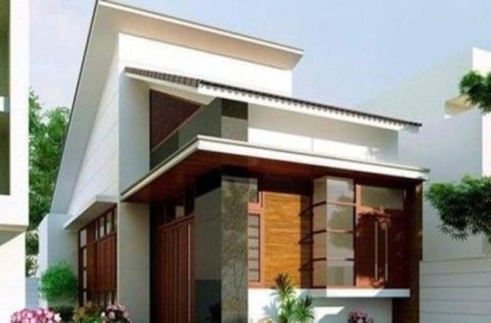 Nhà 1 tầng mái lệch có gác lửng ấn tượng với thiết kế phá cách. Màu gạch giả gỗ kết hợp sơn trắng tôn thêm vẻ đẹp của ngôi nhà. (Ảnh: Ahthomes)