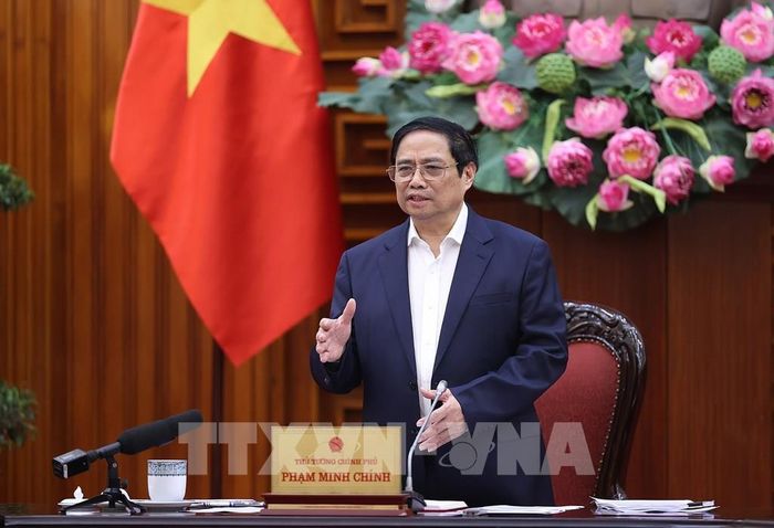 Thủ tướng Phạm Minh Chính chủ trì họp Thường trực Chính phủ về giải pháp giảm lãi suất và thúc đẩy thị trường bất động sản. Ảnh: Dương Giang-TTXVN 