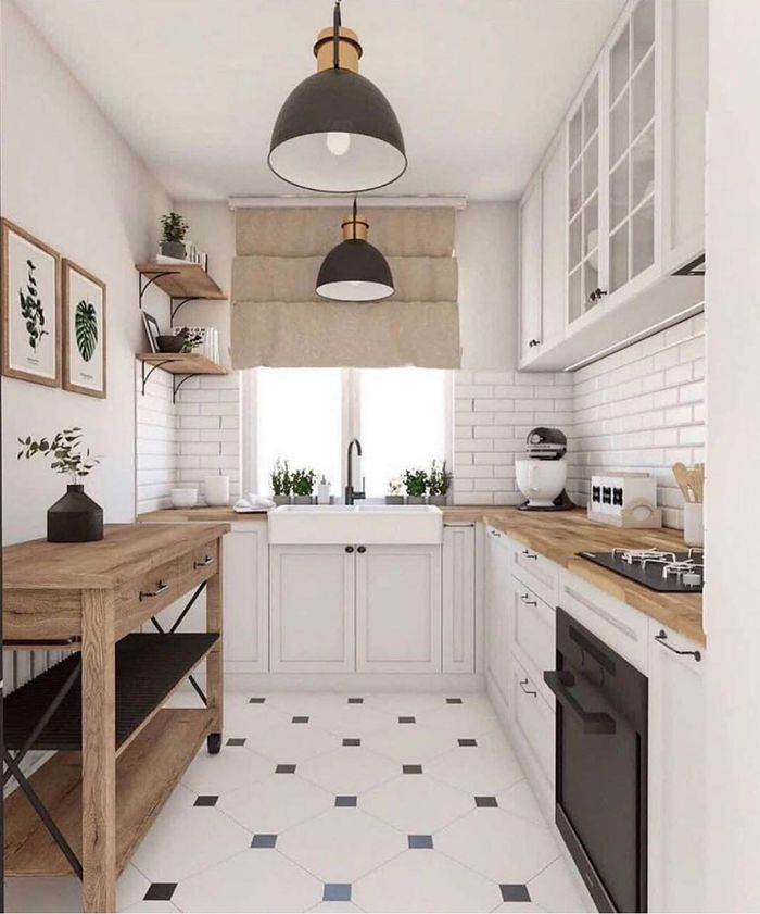 Đồ nội thất màu trắng và các thiết kế màu gỗ nguyên bản cũng khiến tổng thể căn bếp trông rất ấm áp.
