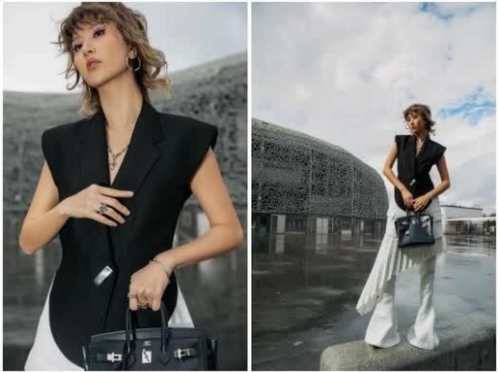Quỳnh Anh Shyn trong thiết kế áo blazer của C.Dam, phối pant-skirt xếp ly với chi tiết đánh cong, kết hợp hai tông màu nâu tro và trắng tại Paris Fashion Week