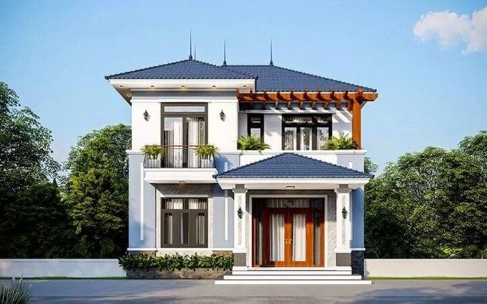 Mẫu nhà 2 tầng mái thái, hiện đại được xây dựng với chi phí 1 tỷ có nhiều ô cửa kính tận dụng lấy sáng. (Ảnh: Vinavic)