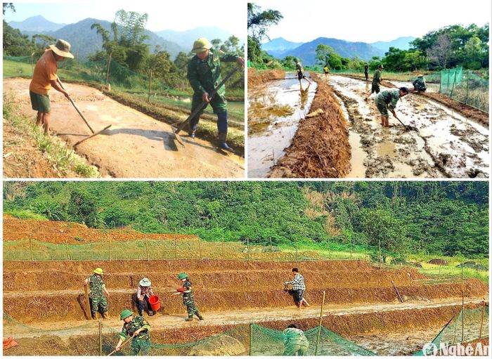 Cán bộ Đồn Biên phòng Nậm Càn (Kỳ Sơn) giúp gia đình ông Và Chứ Rùa bản Nậm Càn canh tác trồng lúa nước. Ảnh: G.H