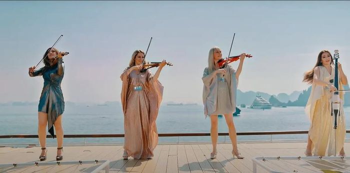 Nhóm tứ tấu Bond trình diễn “Victory” giữa khung cảnh Vịnh Hạ Long. Ảnh chụp từ MV