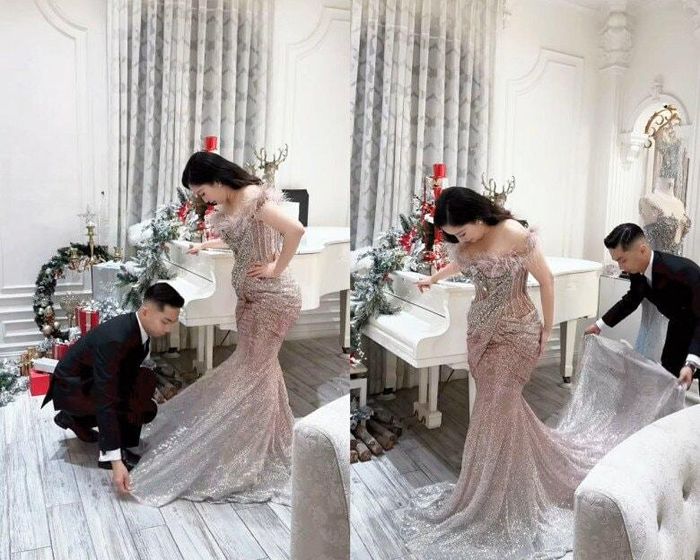 Phan Hiển chu đáo chỉnh váy cho bà xã.