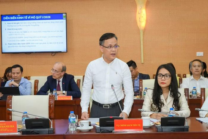 Ông Phạm Chí Quang - Vụ trưởng Vụ Chính sách tiền tệ phát biểu tại cuộc họp. (Ảnh: Vietnam+)