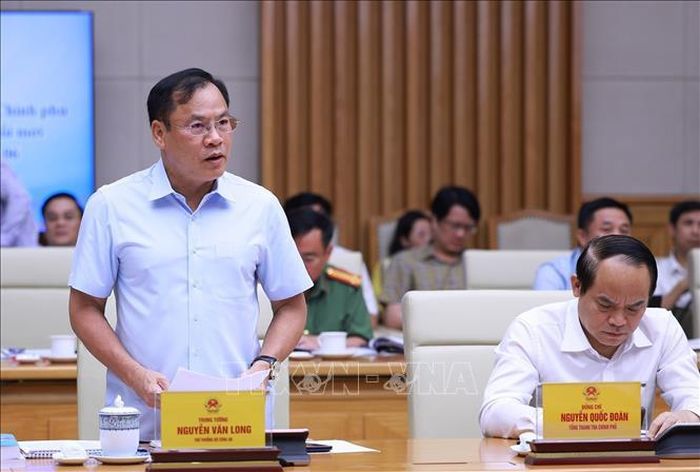 Thượng tướng Nguyễn Văn Long, Thứ trưởng Bộ Công an báo cáo kết quả triển khai Đề án 06. Ảnh: Dương Giang/TTXVN