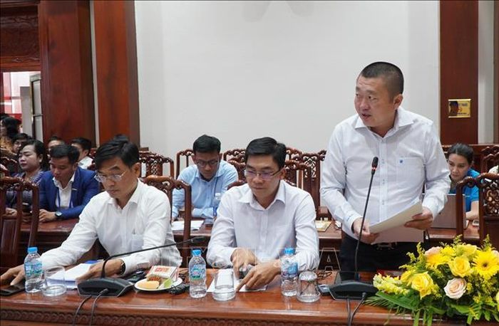Đại diện doanh nghiệp trao đổi về hợp tác thương mại tại hội nghị. Ảnh: Hồng Thái/TTXVN