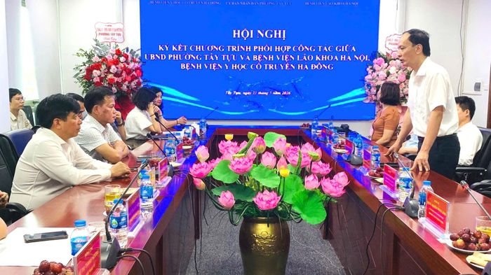 Đại biểu trao đổi thảo luận tại chương trình ký kết. Ảnh PV