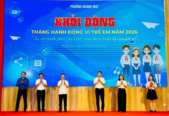 Các đại biểu thực hiện nghi thức bấm nút khởi động Tháng hành động vì trẻ em năm 2026. Ảnh: Trần Oanh