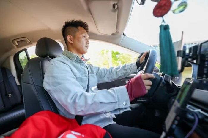 Hiện Trung Quốc có khoảng 13 triệu tài xế xe công nghệ, thường phải làm việc 12-16 giờ/ngày. Ảnh: Xinhua.