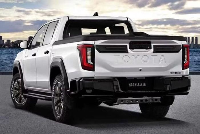 Gói nâng cấp Modellista cho Toyota Hilux 2026 mới được bổ sung nhiều chi tiết màu đen ở nắp ca-pô, viền đèn pha và cửa thùng hàng phía sau. Cản trước và cản sau cũng được thiết kế lại với các chi tiết trang trí tích hợp đèn LED.