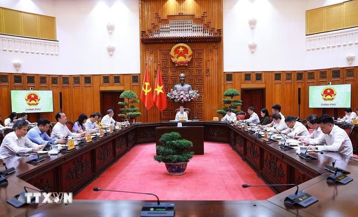 Thủ tướng Lê Minh Hưng chủ trì cuộc họp về phát triển Trung tâm tài chính quốc tế tại Việt Nam. (Ảnh: Dương Giang/TTXVN)