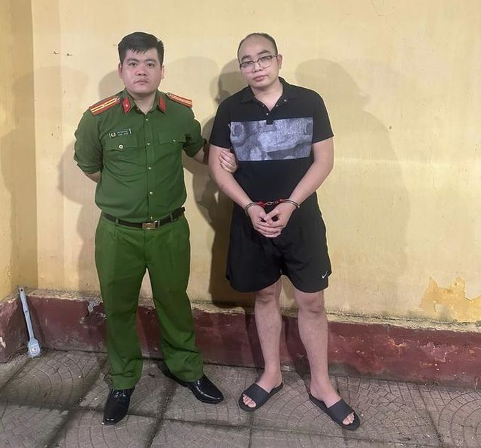 Đối tượng Phạm Ngọc Mạnh tại cơ quan Công an. Ảnh: CAHN