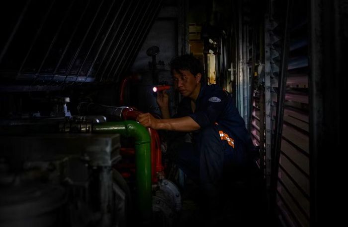 Một tác phẩm của nghệ sĩ nhiếp ảnh Quang Tuấn về người lao động.