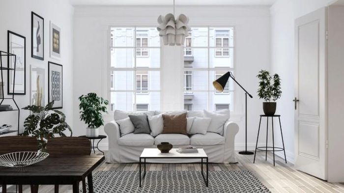 Bố trí sofa lệch so với cửa chính hoặc sử dụng vách ngăn nhẹ, kệ trang trí để điều tiết không gian. Ảnh minh họa.