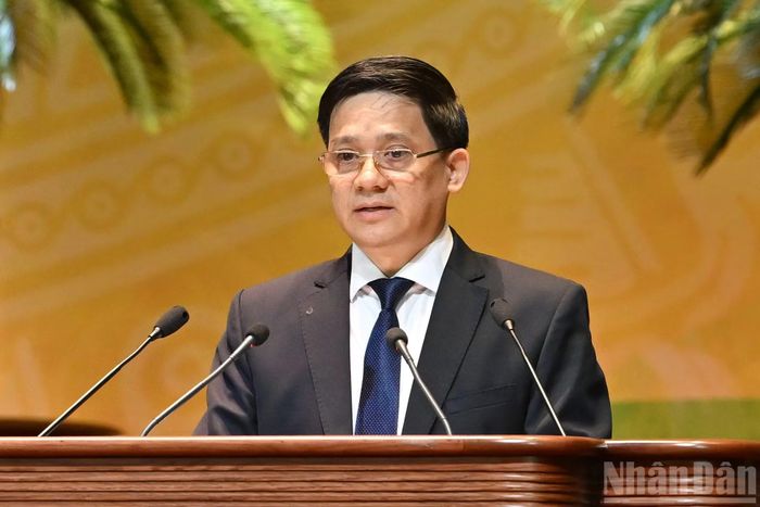 Phó Chủ tịch Ban Chấp hành Trung ương Hội Nông dân Việt Nam Phạm Tiến Nam trình bày Báo cáo kết quả thẩm tra tư cách đại biểu dự Đại hội đại biểu toàn quốc Hội Nông dân Việt Nam lần thứ IX.