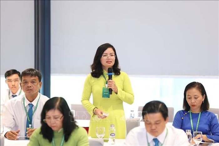 Đại biểu Võ Thị Kim Đương, Chủ tịch Hội Nông dân xã Hiệp Phước, TP Hồ Chí Minh góp ý về báo cáo chính trị. Ảnh: Hoàng Hiếu/TTXVN