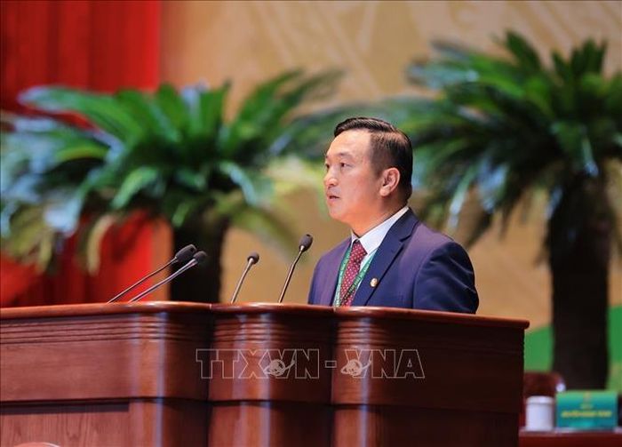 Chủ tịch Hội Nông dân tỉnh Bắc Ninh Nguyễn Hoàng Trung trình bày tham luận những đổi mới, sáng tạo về hoạt động hội tại tỉnh Bắc Ninh. Ảnh: Hoàng Hiếu/TTXVN.