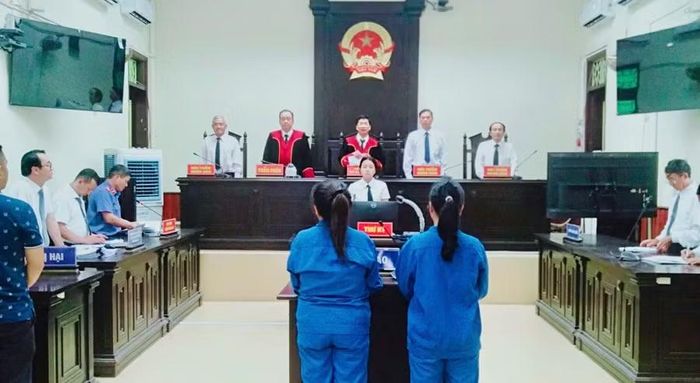 Hội đồng xét xử tuyên phạt bị cáo Ngộ 20 năm tù và bị cáo Vân 12 năm tù. Ảnh: N.L