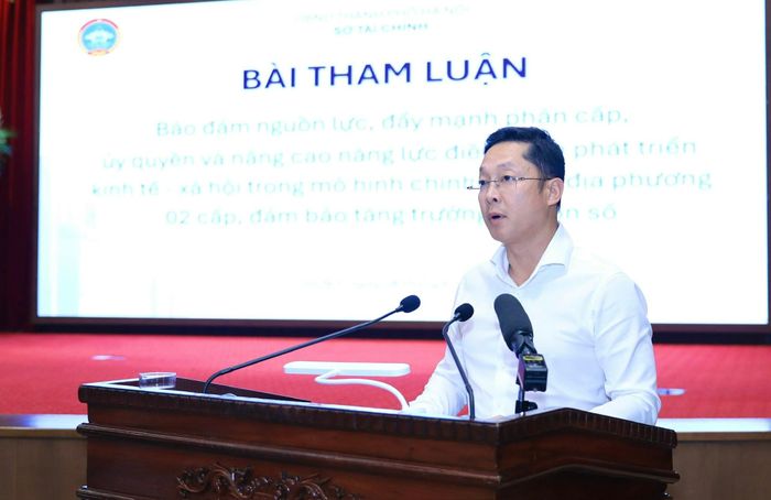 Giám đốc Sở Tài chính Nguyễn Ngọc Tú trình bày tham luận tại hội nghị. Ảnh: Quang Thái