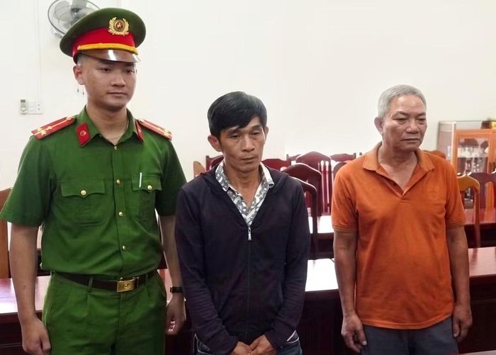 Nguyễn Thanh Tuấn và Nguyễn Văn Thái tại cơ quan công an.