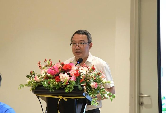 Ông Hồ Quang Huy, Cục trưởng Cục Kiểm tra văn bản và Tổ chức thi hành pháp luật, Bộ Tư pháp báo cáo đề dẫn tại hội thảo - Ảnh: VGP/DA