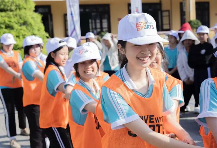 Học sinh nữ hào hứng tham gia ngày hội "Nữ sinh năng động". (Nguồn: Vietnam+)
