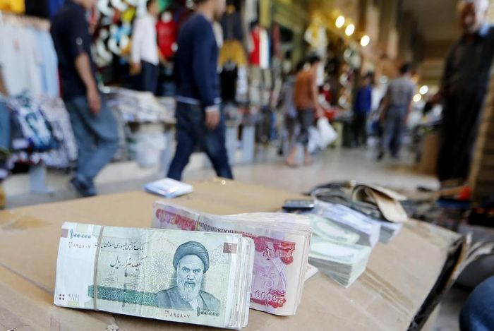 Tờ tiền rial của Iran - Ảnh: Bloomberg
