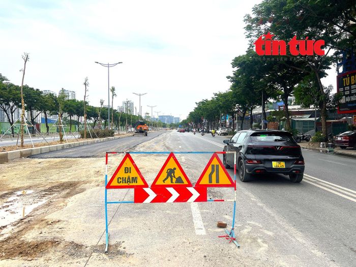 Sau 3 tháng rào chắn để thi công, nhà thầu đang khẩn trương hoàn trả mặt đường và các hạng mục kỹ thuật trên đường Võ Chí Công.