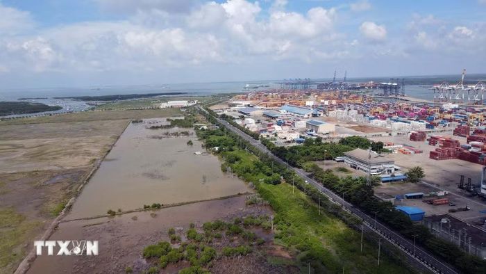 Hệ thống cảng hiện hữu trên sông Thị Vải-Cái Mép và một phần đất trống sau cảng quy hoạch làm Khu thương mại tự do Cái Mép Hạ. (Ảnh: Đoàn Mạnh Dương/TTXVN)