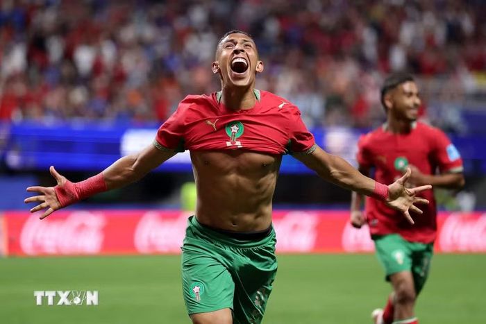 Maroc cùng có 7 điểm như Brazil nhưng chỉ xếp nhì bảng C do hiệu số bàn thắng bại kém hơn. (Ảnh: AFP/TTXVN)