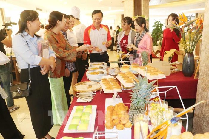 Các món ăn được chế biến từ sầu riêng phục vụ quan khách tại buổi lễ khai mạc. Ảnh: Ngọc Thiện- TTXVN