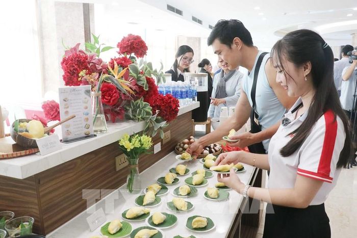 Các món ăn được chế biến từ sầu riêng phục vụ quan khách tại buổi lễ khai mạc. Ảnh: Ngọc Thiện- TTXVN