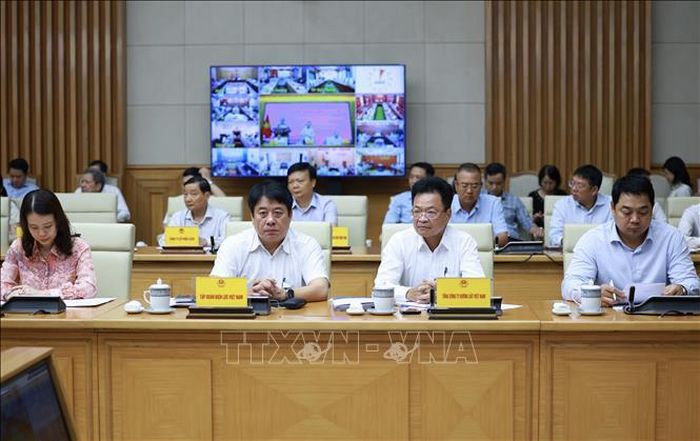 Các đại biểu tham dự hội nghị tại điểm cầu trụ sở Chính phủ. Ảnh: TTXVN