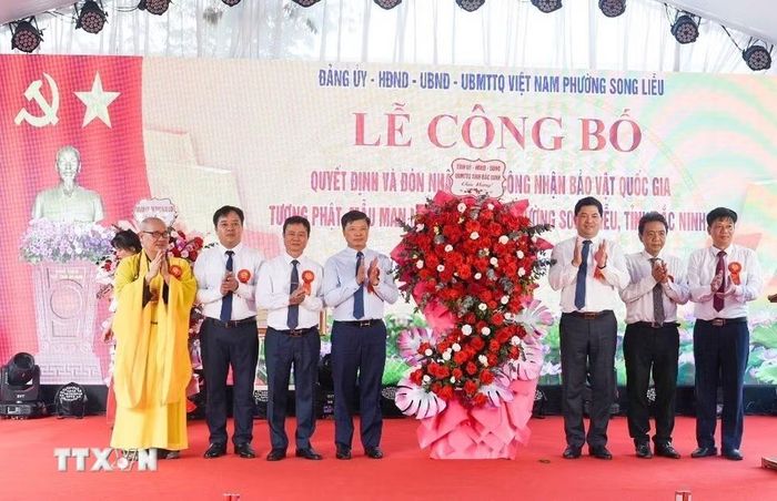 Lễ công bố Quyết định và đón nhận Bằng công nhận Bảo vật Quốc gia đối với tượng Phật Mẫu Man Nương. (Ảnh: Thanh Thương/TTXVN)