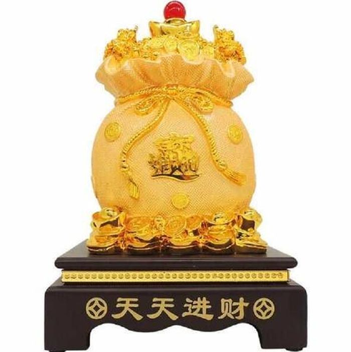 Túi tiền kim bảo giúp mọi dự định đều hoàn thành và thành công. Vì vậy, đặt túi tiền kim bảo trên bàn Thần tài là một lựa chọn vô cùng hợp lý.